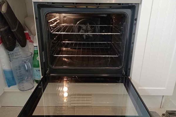 open oven showin the cavity and the oven light is on