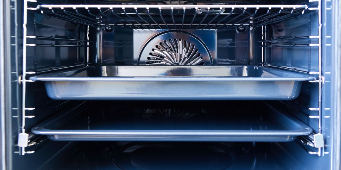 inside an oven cavity showing the tray and racks