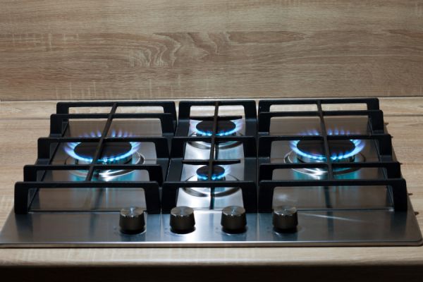 gas stove with the burners on