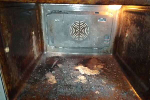 inside  a dirty oven before cleaning