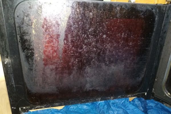 dirty door of a oven